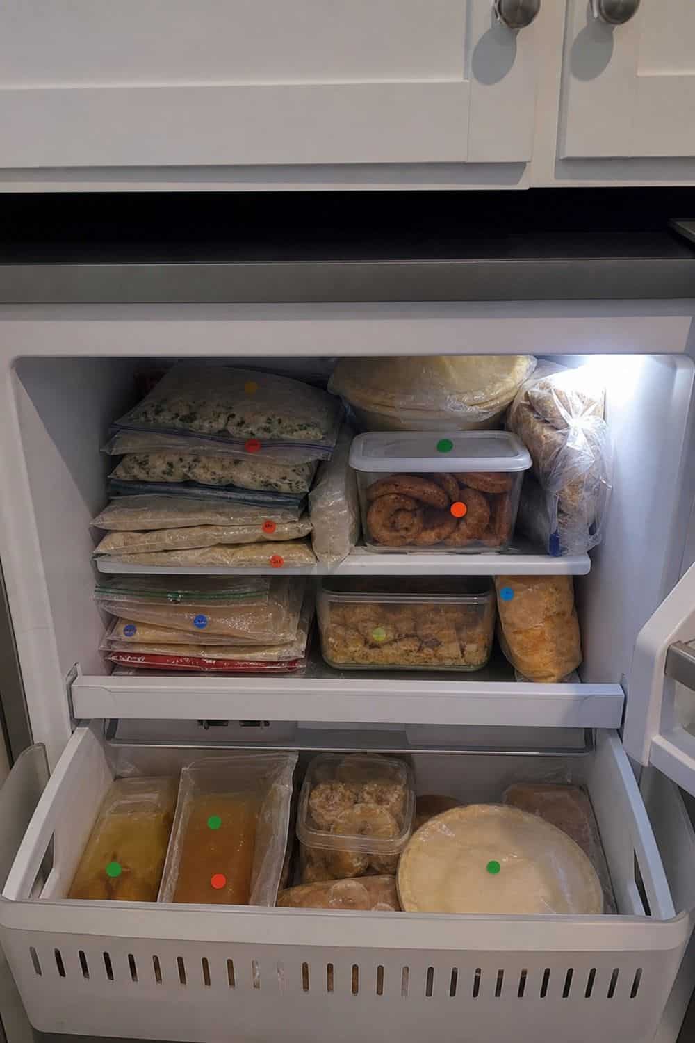 25 Christmas Kitchen Organization Ideas for Baking and Hosting freezer shelf for dough, cookies, and appetizers for Christmas kitchen organization.