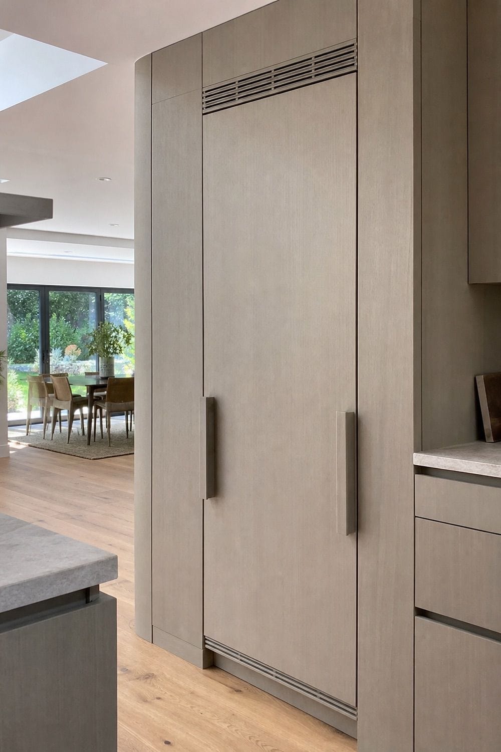 25 Contemporary Kitchen Ideas for a Clean, Polished Layout 12. Paneled Refrigerator for a Built-In Look