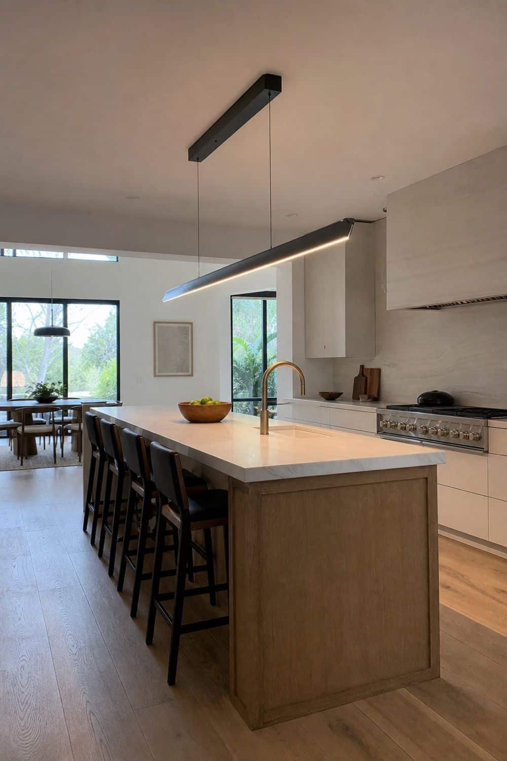 25 Contemporary Kitchen Ideas for a Clean, Polished Layout 17. Sculptural Linear Chandelier Over the Island
