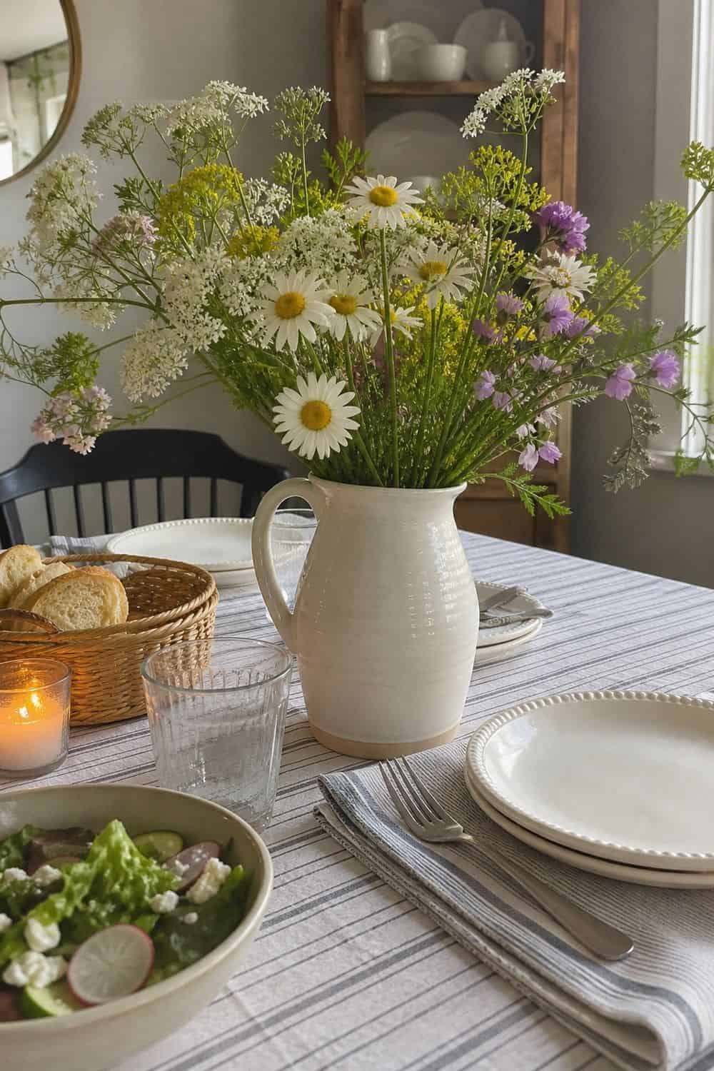 25 Cottagecore Tablescape Ideas for a Soft Floral Table 9. Flowers in a Ceramic Pitcher cottagecore tablescape idea