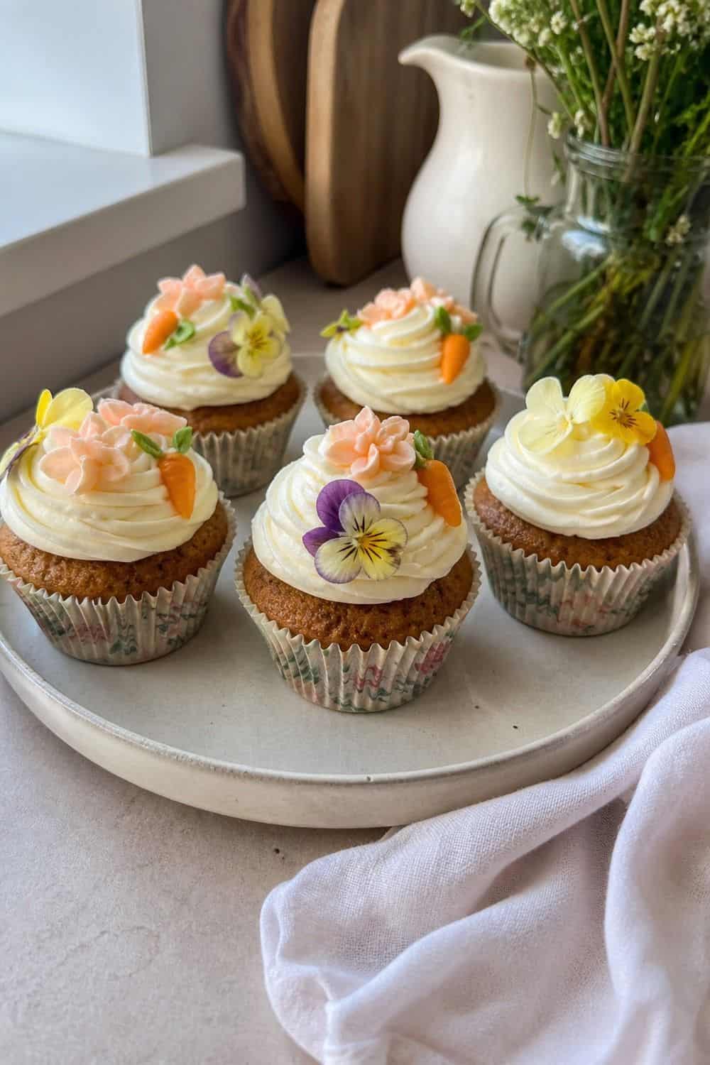 25 Easter Dessert Table Ideas for a Pretty Spring Spread easter dessert table 02 floral carrot cupcakes