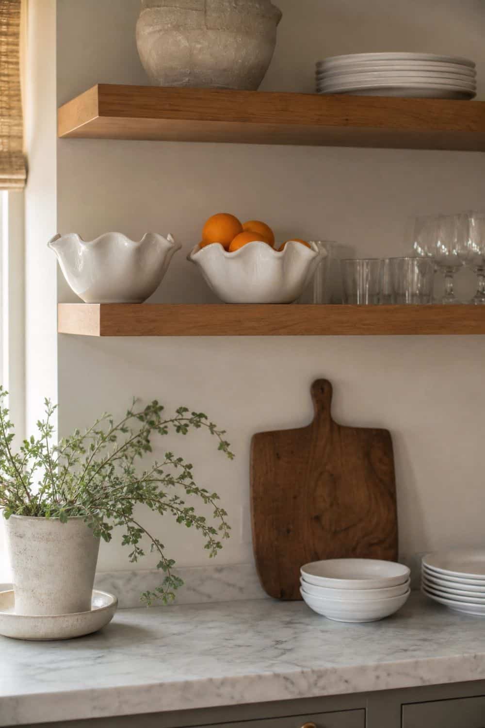 25 Easter Kitchen Decor Ideas for a Fresh Spring Touch Ruffle-Edge Ceramics on Open Shelves for Easter kitchen decor