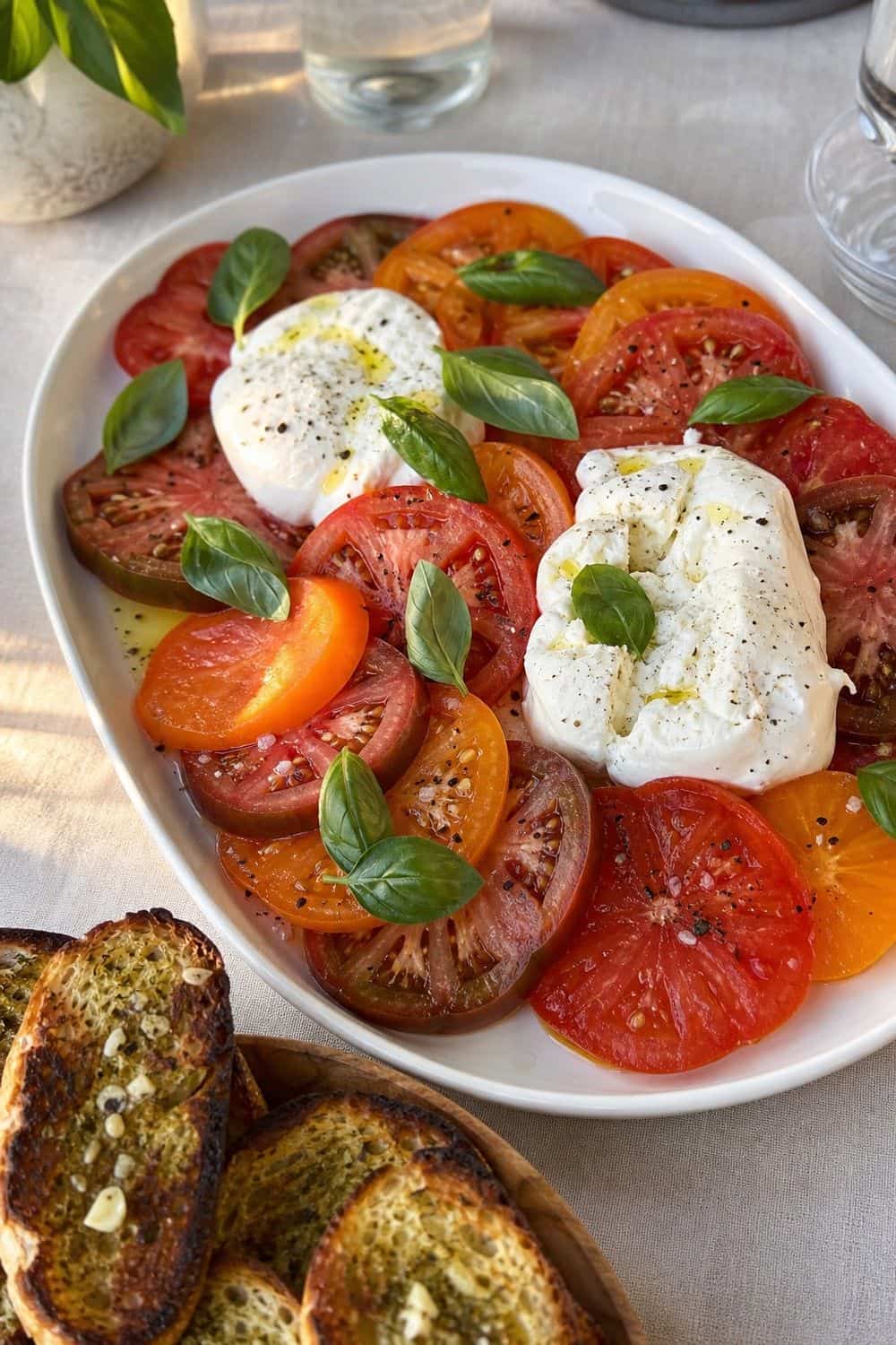 25 European Summer Dinner Party Ideas for a Long, Sunlit Table tomato and burrata platter for a European summer dinner party