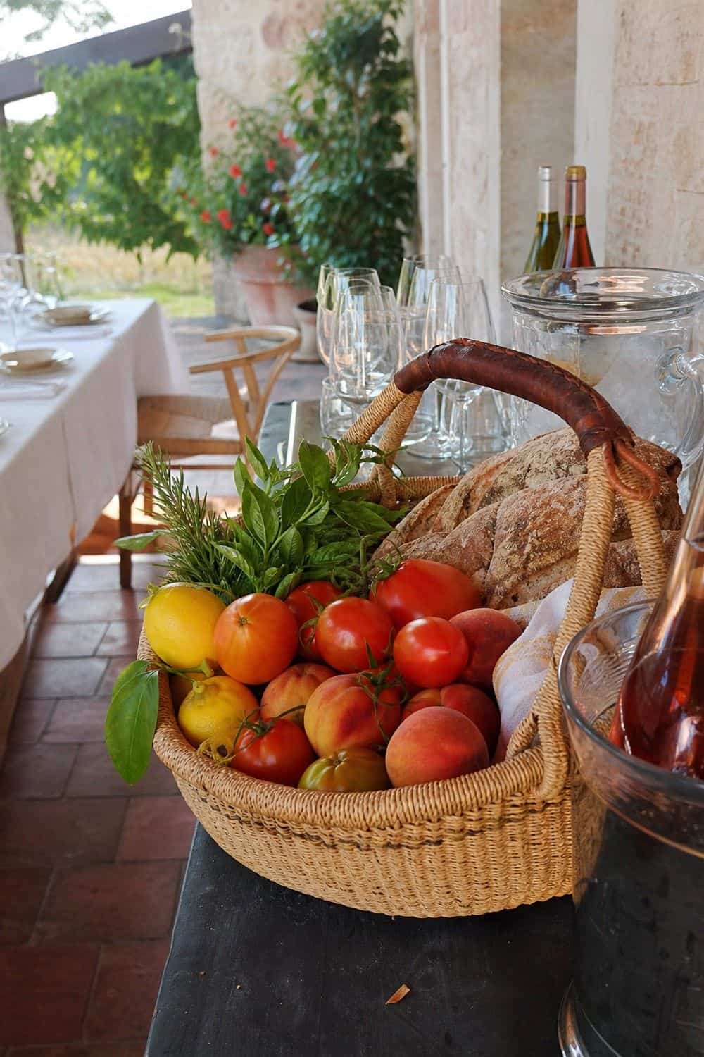 25 European Summer Dinner Party Ideas for a Long, Sunlit Table market basket as produce decor for a European summer dinner party