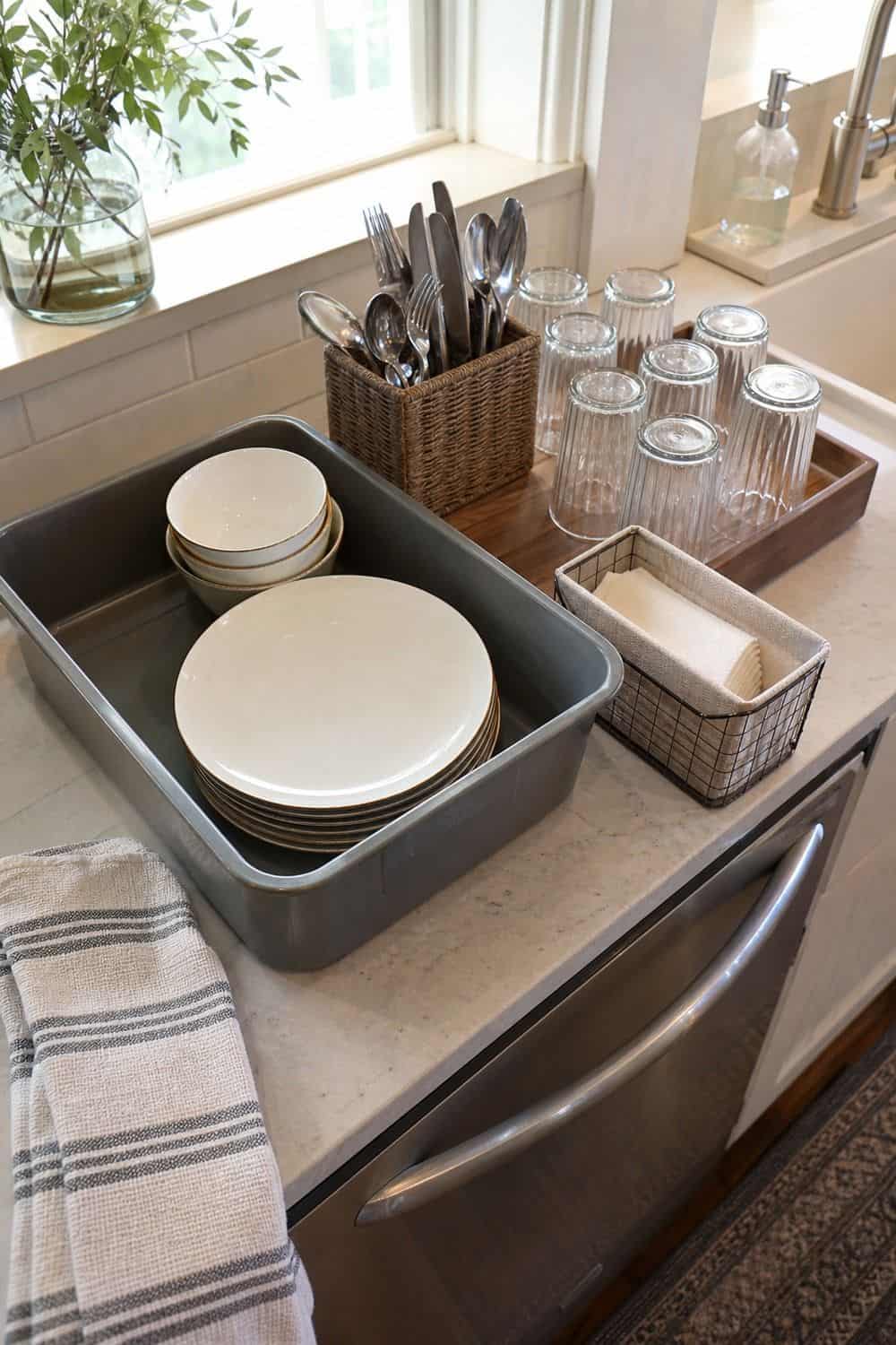 Fall dinner party idea showing create a plate and glass return spot in a clean, cozy hosting setup.