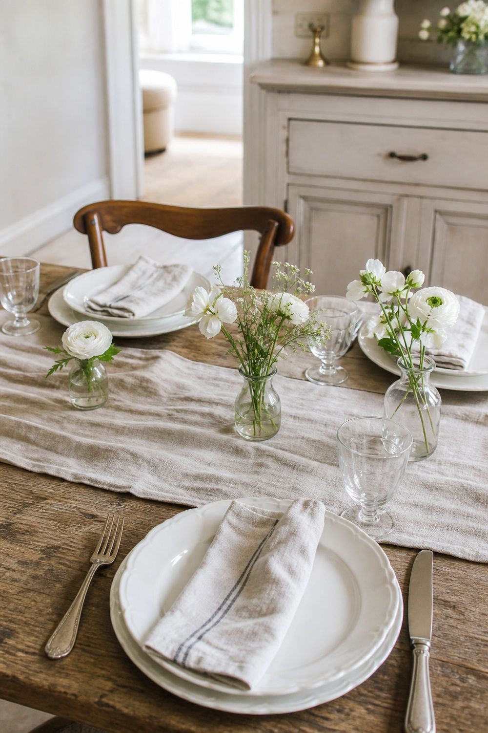 25 French Country Tablescape Ideas for Rustic Elegance 18. White Flowers in Bud Vases