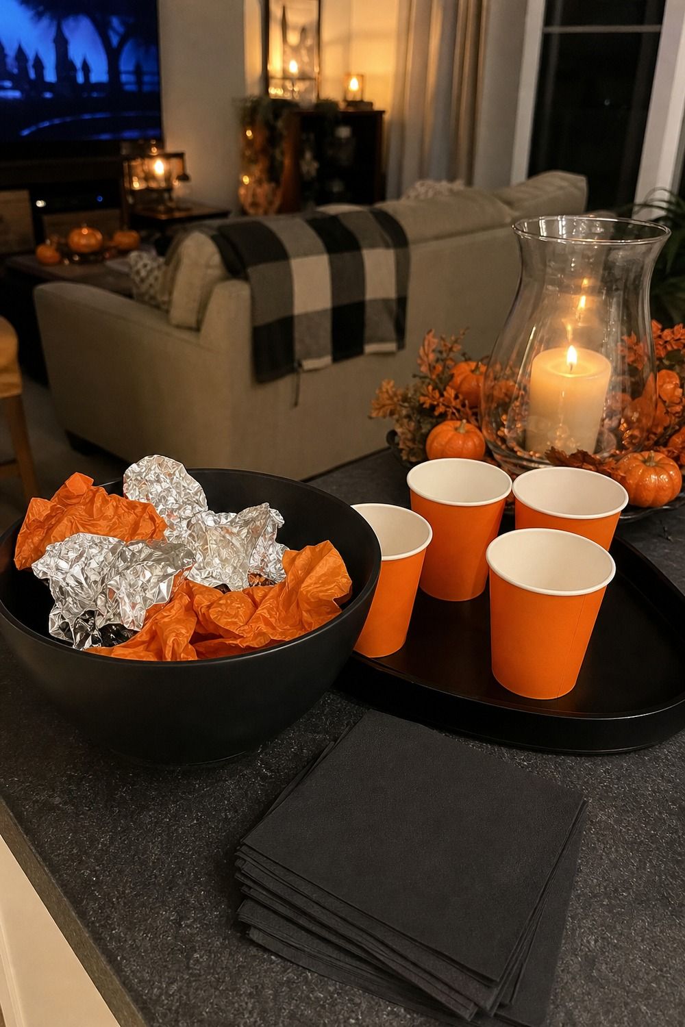 25 Halloween Movie Night Hosting Ideas for Easy Hosting 17. Set Up a Wrapper and Cup Return Spot for a Halloween movie night hosting setup.