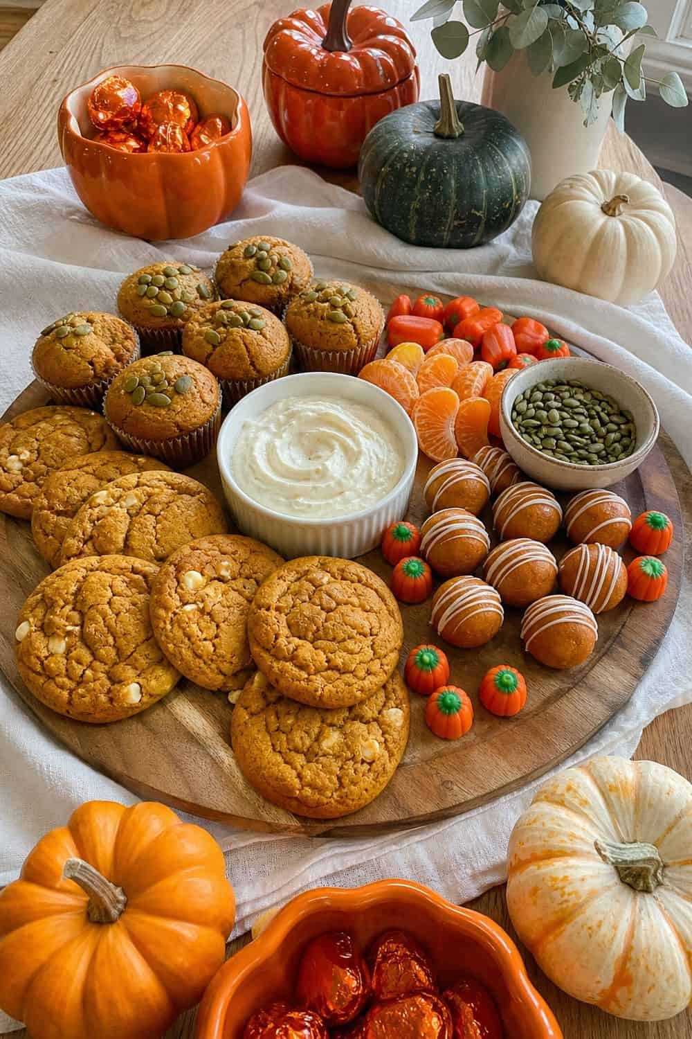 20 Halloween Treat Board Ideas for Cozy Food Moments 8. Pumpkin Patch Treat Board Halloween treat board idea arranged on a cozy home table