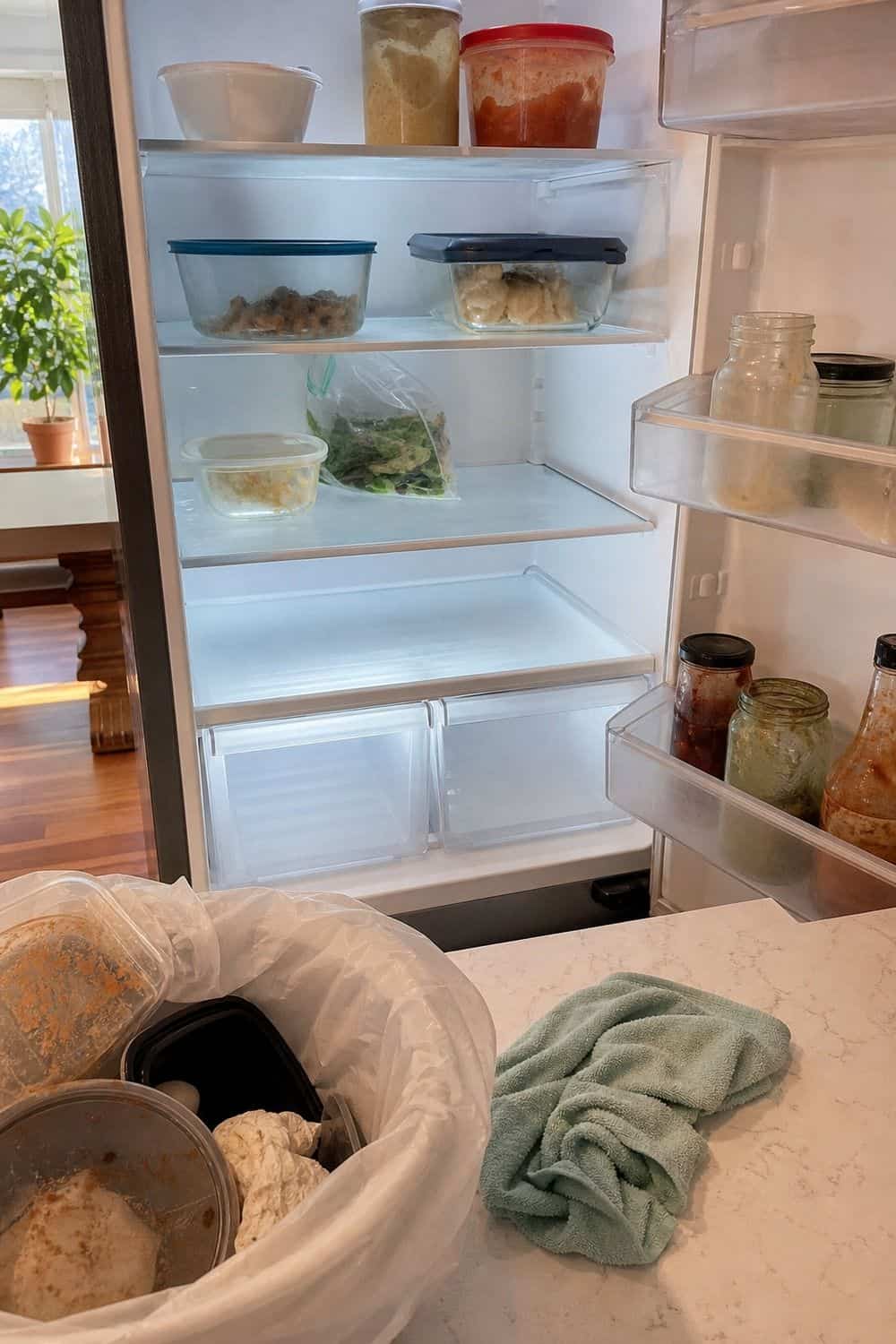 20 Holiday Fridge Ideas for Party Prep and Leftovers Holiday fridge idea showing do a fridge clean-out before the holiday grocery run.