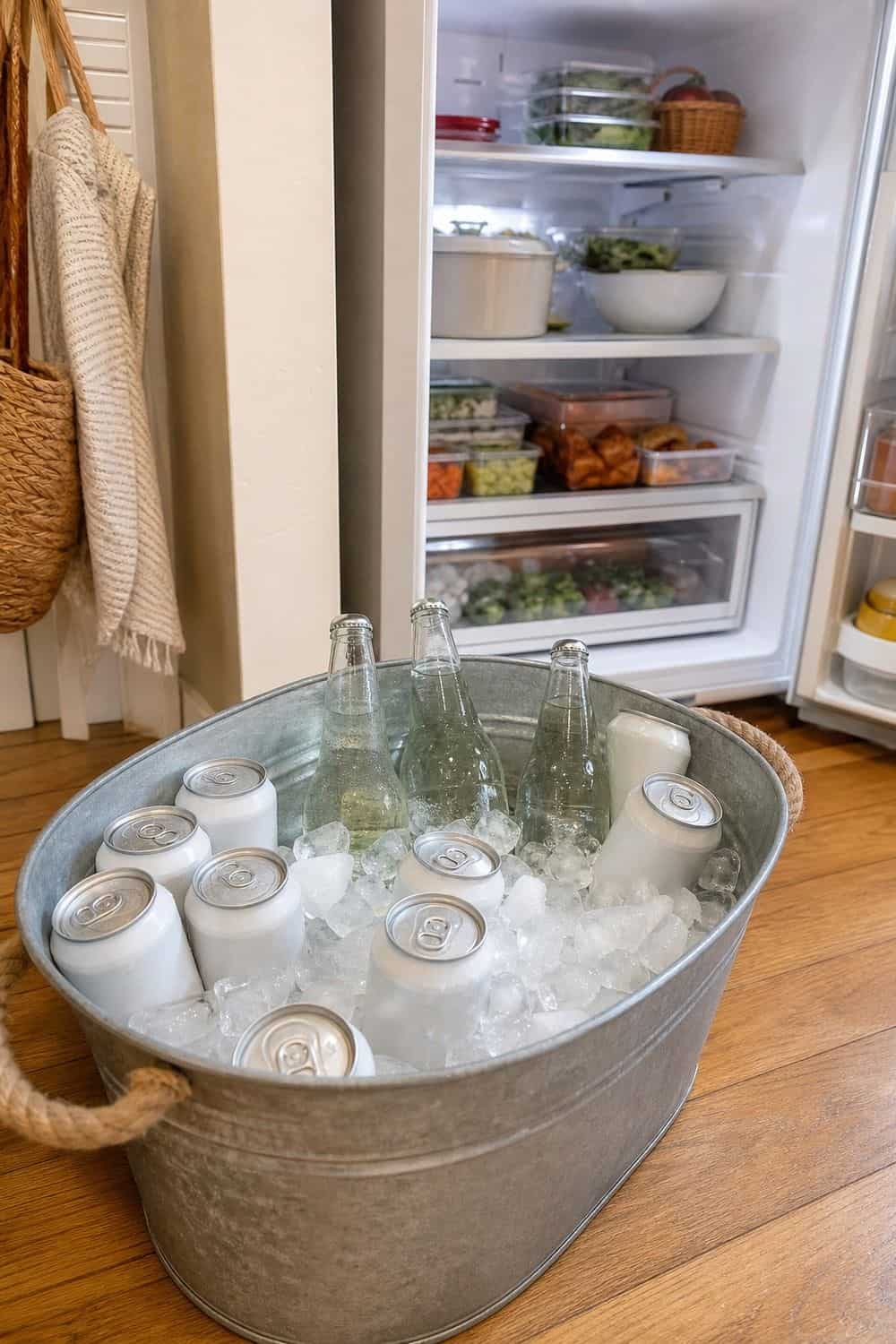 20 Holiday Fridge Ideas for Party Prep and Leftovers Holiday fridge idea showing move drinks to a cooler or beverage tub.
