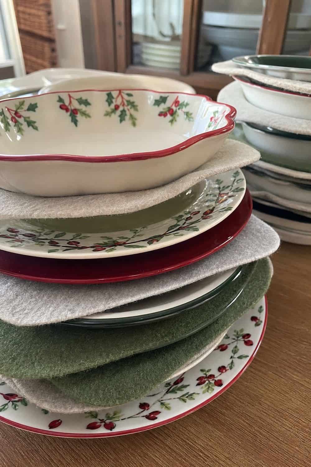 25 Holiday Serving Dish Organization Ideas Put Felt Separators Between Stacked Plates and Bowls for holiday serving dish organization in a real home kitchen
