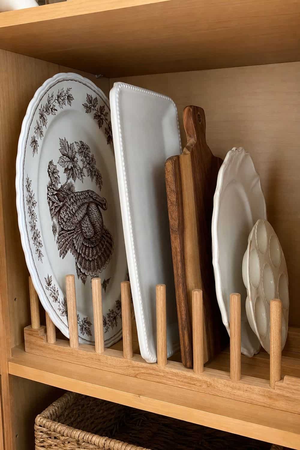 25 Holiday Serving Dish Organization Ideas Store Oversized Platters Vertically in a Divider Rack for holiday serving dish organization in a real home kitchen