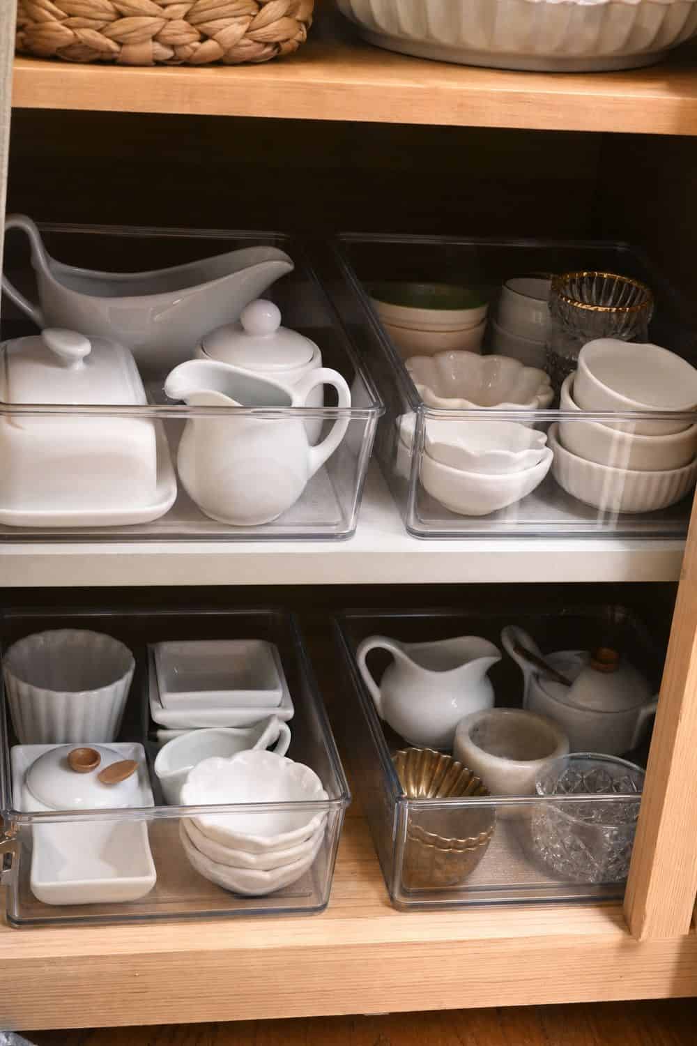 25 Holiday Serving Dish Organization Ideas Use Clear Bins for Small Holiday Serving Pieces for holiday serving dish organization in a real home kitchen