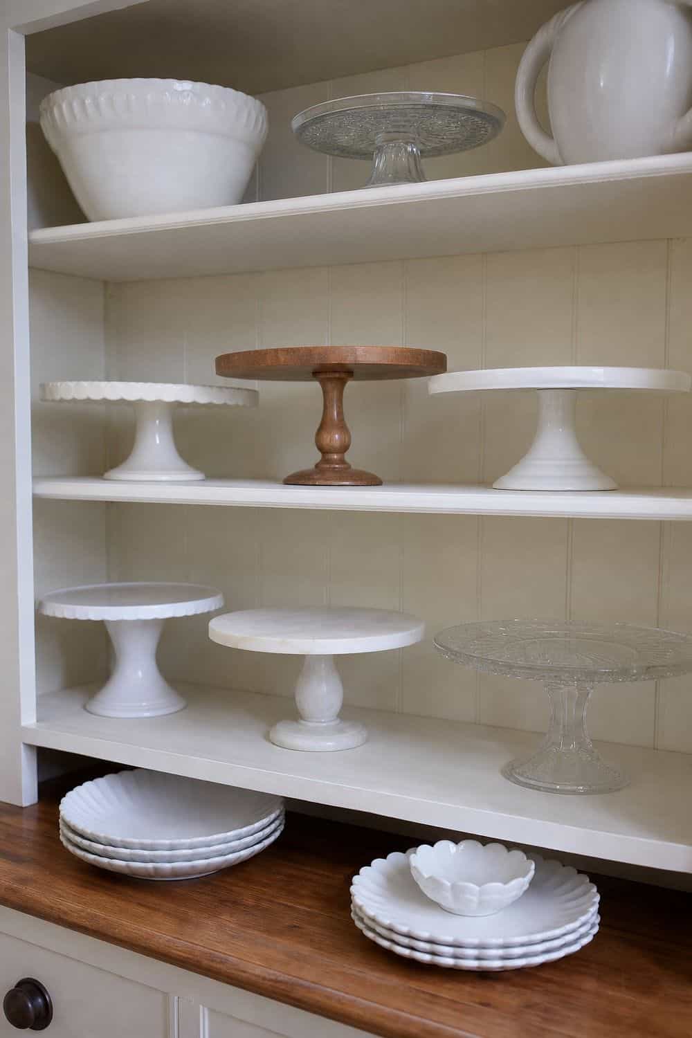 25 Holiday Serving Dish Organization Ideas Store Cake Stands Where the Bases Will Not Tip for holiday serving dish organization in a real home kitchen