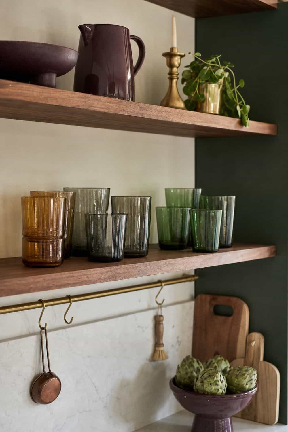 25 Jewel Tone Kitchen Ideas for a Beautiful Kitchen smoked glassware on the shelf in a realistic jewel tone kitchen