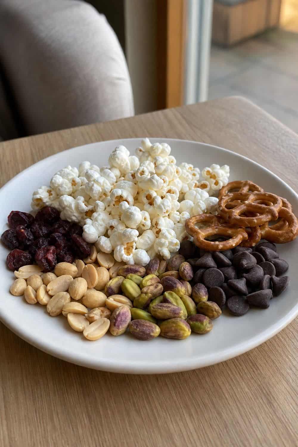 15 Little Treat Plate Ideas for Cozy Food Moments 14. Popcorn Chocolate Trail Plate
