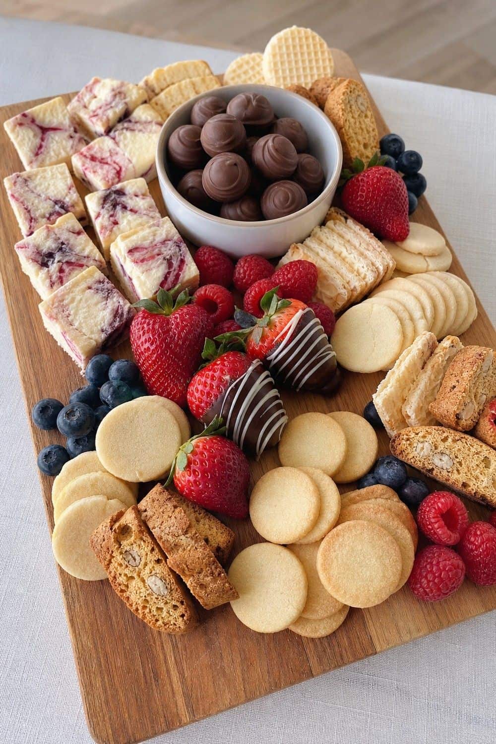 20 New Year's Eve Dessert Board Ideas for Easy Hosting New Year's Eve dessert board idea with use shortbread and butter cookies as fillers