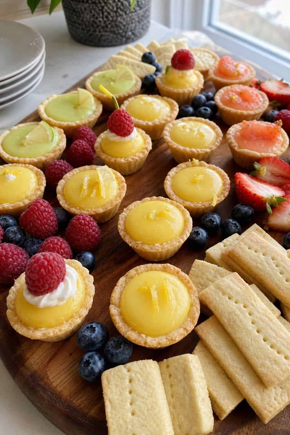 20 New Year's Eve Dessert Board Ideas for Easy Hosting New Year's Eve dessert board idea with include lemon or citrus tassies
