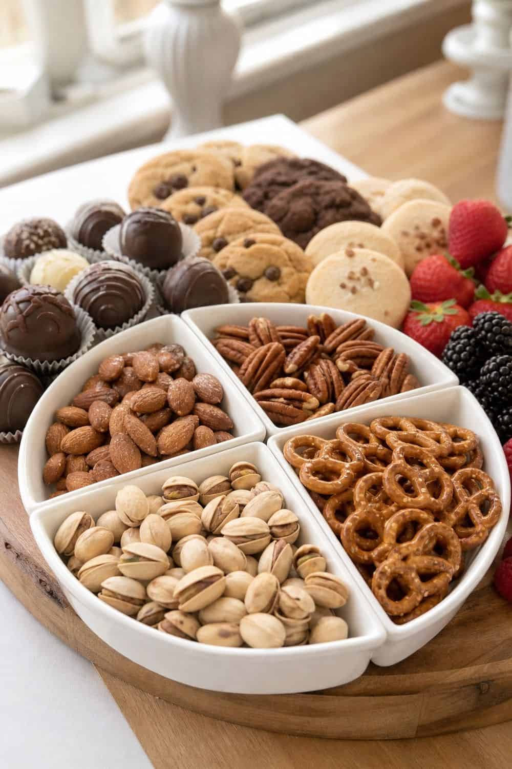 20 New Year's Eve Dessert Board Ideas for Easy Hosting New Year's Eve dessert board idea with balance sweets with pretzels and nuts