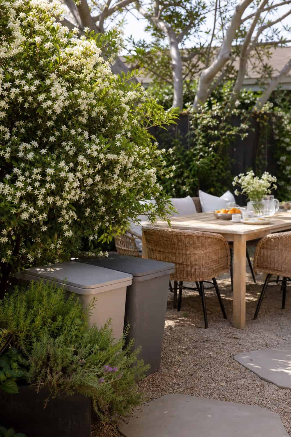 25 Spring Garden Brunch Hosting Ideas for an Outdoor Table Trash and Recycling Nearby but Hidden for a spring garden brunch outdoor table