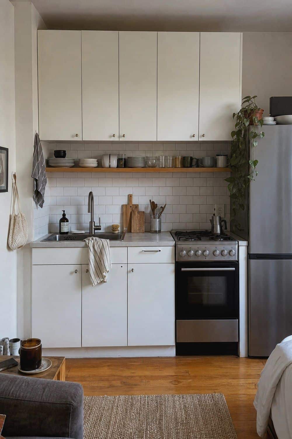25 Studio Apartment Kitchen Ideas for Calm One-Room Living Studio kitchen wall with matching cabinet fronts and backsplash