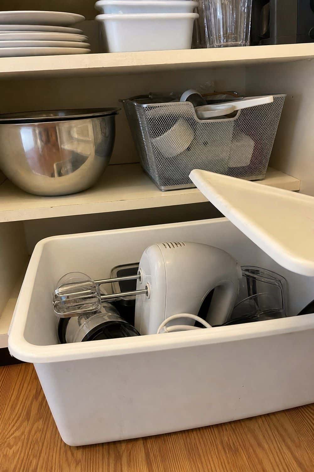 25 Studio Apartment Kitchen Ideas for Calm One-Room Living Covered storage bin holding small kitchen appliance parts