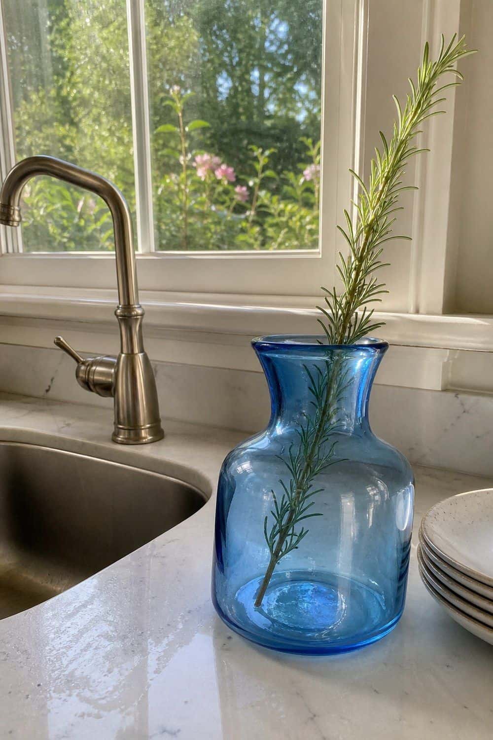 25 Summer Kitchen Decor Ideas for a Lighter Seasonal Look Blue Glass Vase by the Sink in a bright, realistic summer kitchen setting