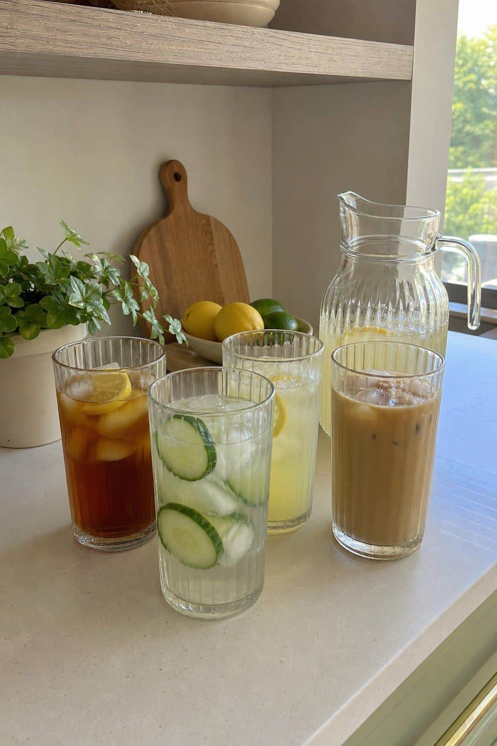 25 Summer Kitchen Decor Ideas for a Lighter Seasonal Look Tall Glasses for Iced Drinks in a bright, realistic summer kitchen setting