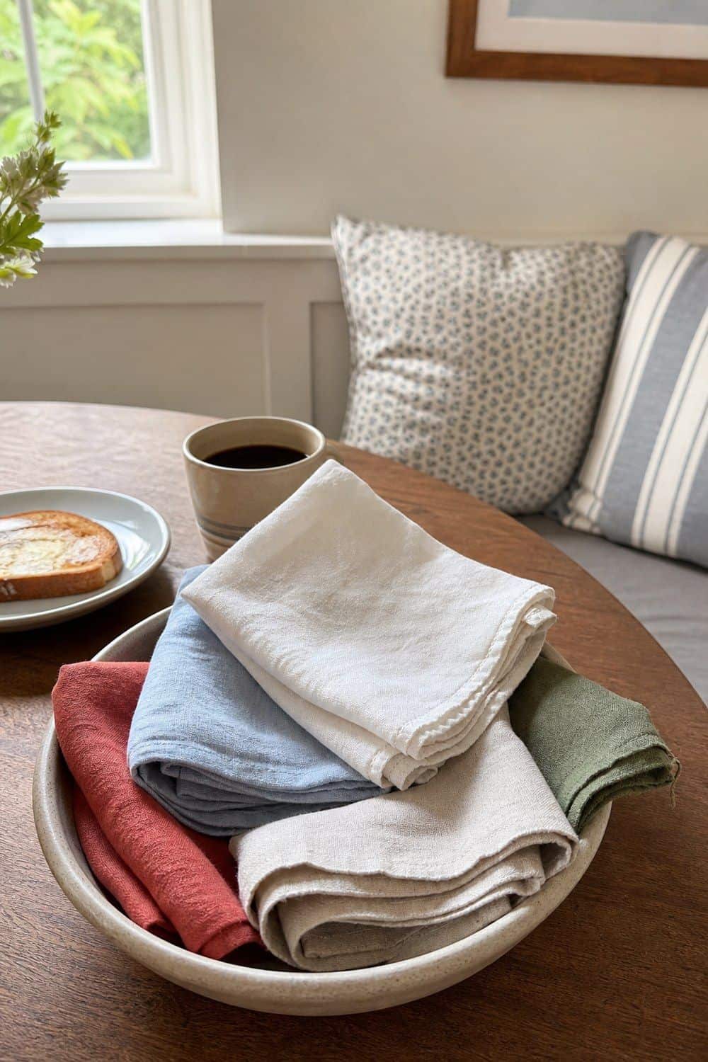 25 Summer Kitchen Decor Ideas for a Lighter Seasonal Look Linen Napkins in the Breakfast Nook in a bright, realistic summer kitchen setting
