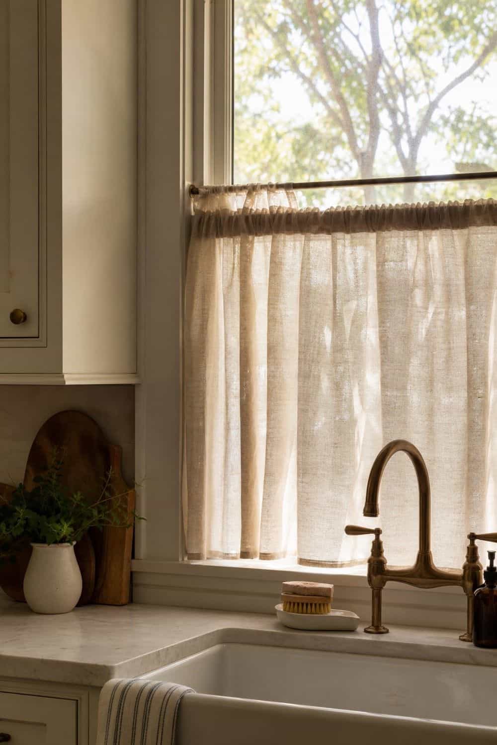 25 Warm Neutral Kitchen Ideas for a Softer Modern Look 17. Bring in Linen Window Treatments
