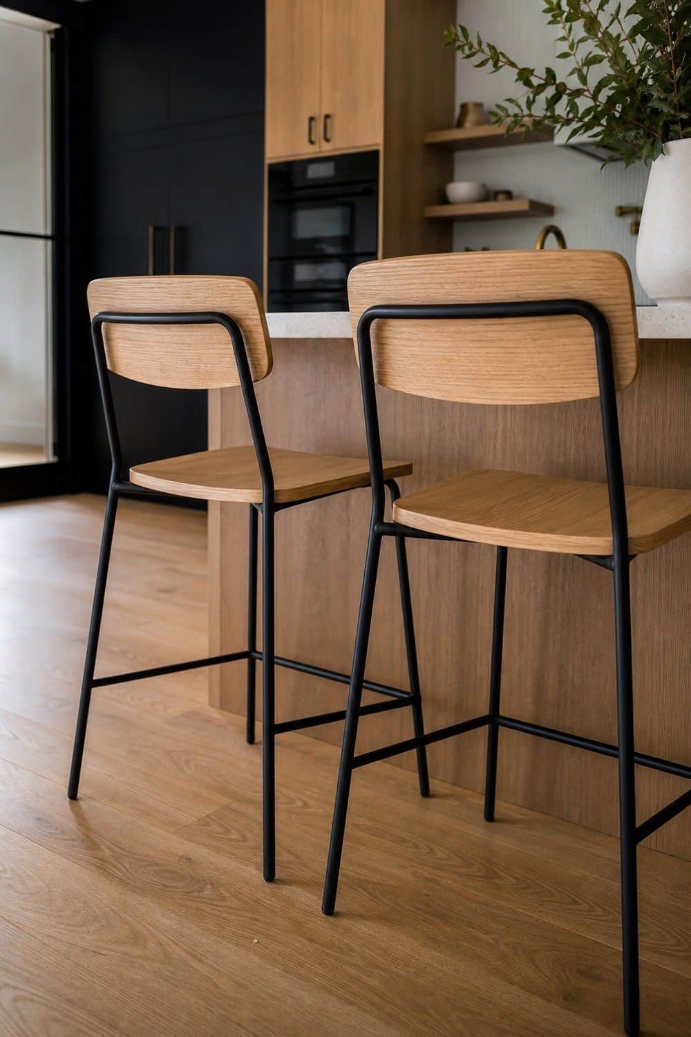 25 White Oak and Black Kitchen Ideas for High-Contrast Warmth White Oak Counter Stools With Black Frames in a white oak and black kitchen